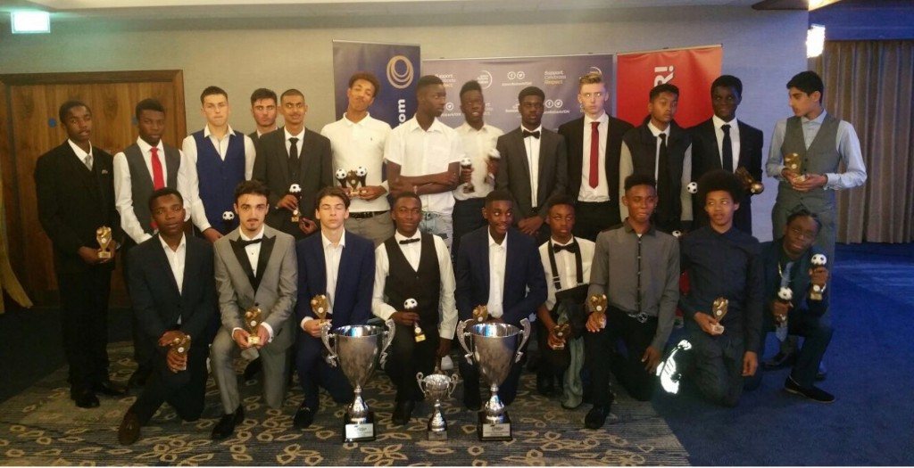 Players with trophies at the end-of-season awards night