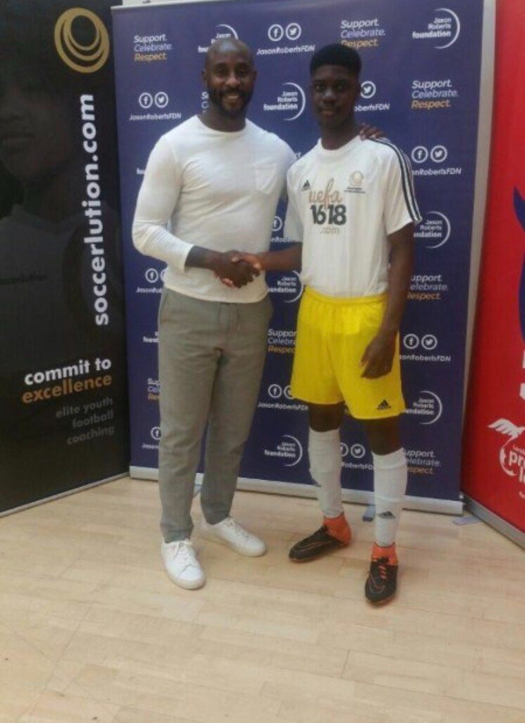 A player shaking hands at a Jason Roberts Foundation event