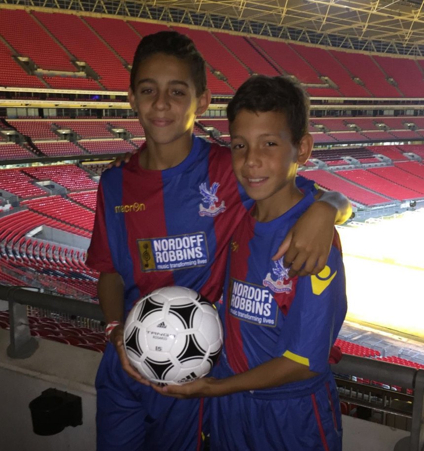 Rio Cardines with his brother at Wembley Stadium, both in Crystal Palace kit