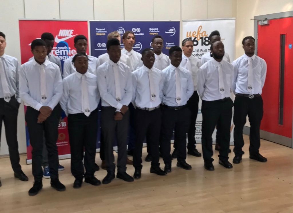 Players in shirts and ties at a season launch